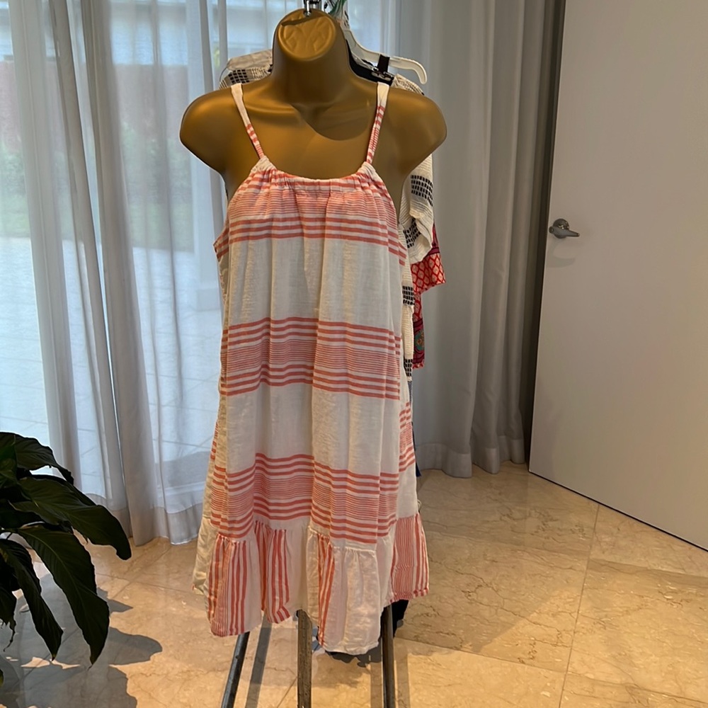 Linen sundress, cream & light tangerine color. Skirt hits just above the knee